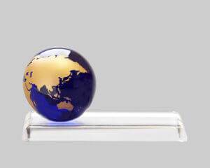custom glass award with globe created by APS in Iowa