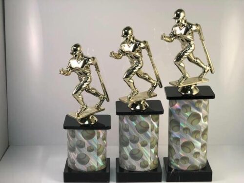 Examples of softball trophies with a running player available at APS.
