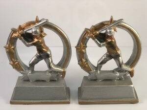 Two copper and aluminum trophies with a baseball player.